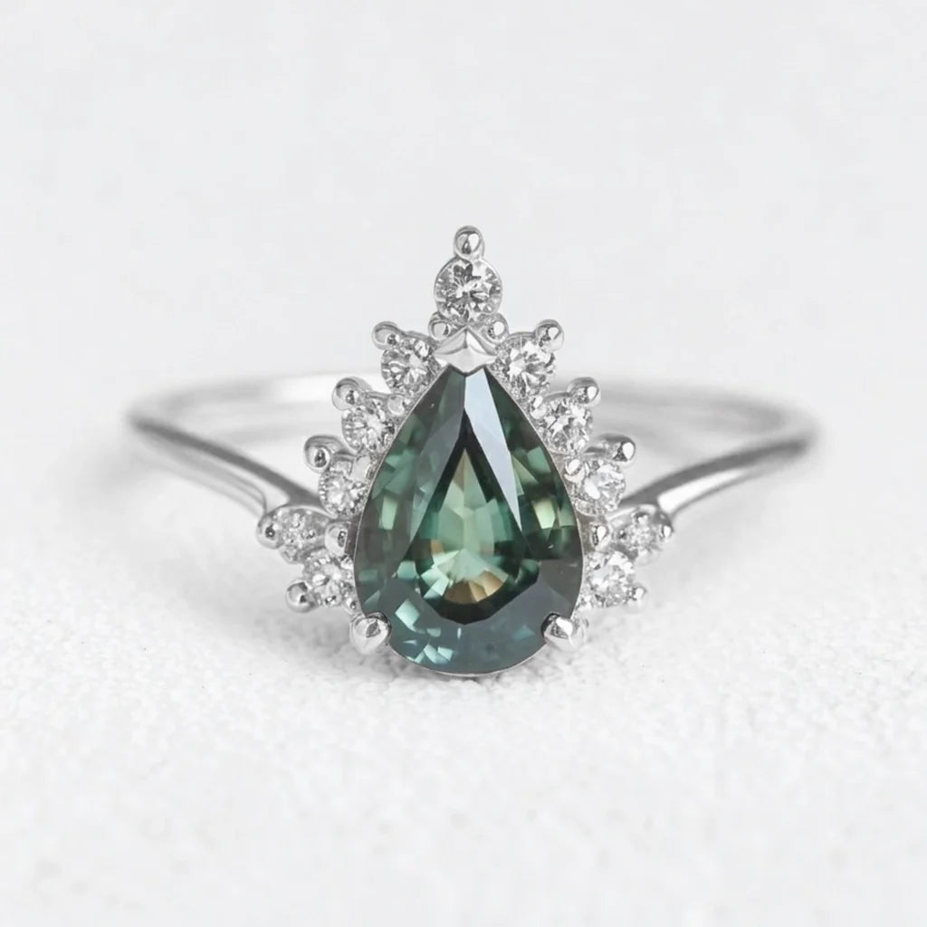 Mermaid’s Crown | Pear Teal Sapphire Halo Engagement Ring