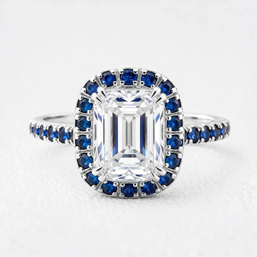 Aurora’s Luminary | 2CT Emerald Cut Diamond Sapphire Halo & Pavé Ring
