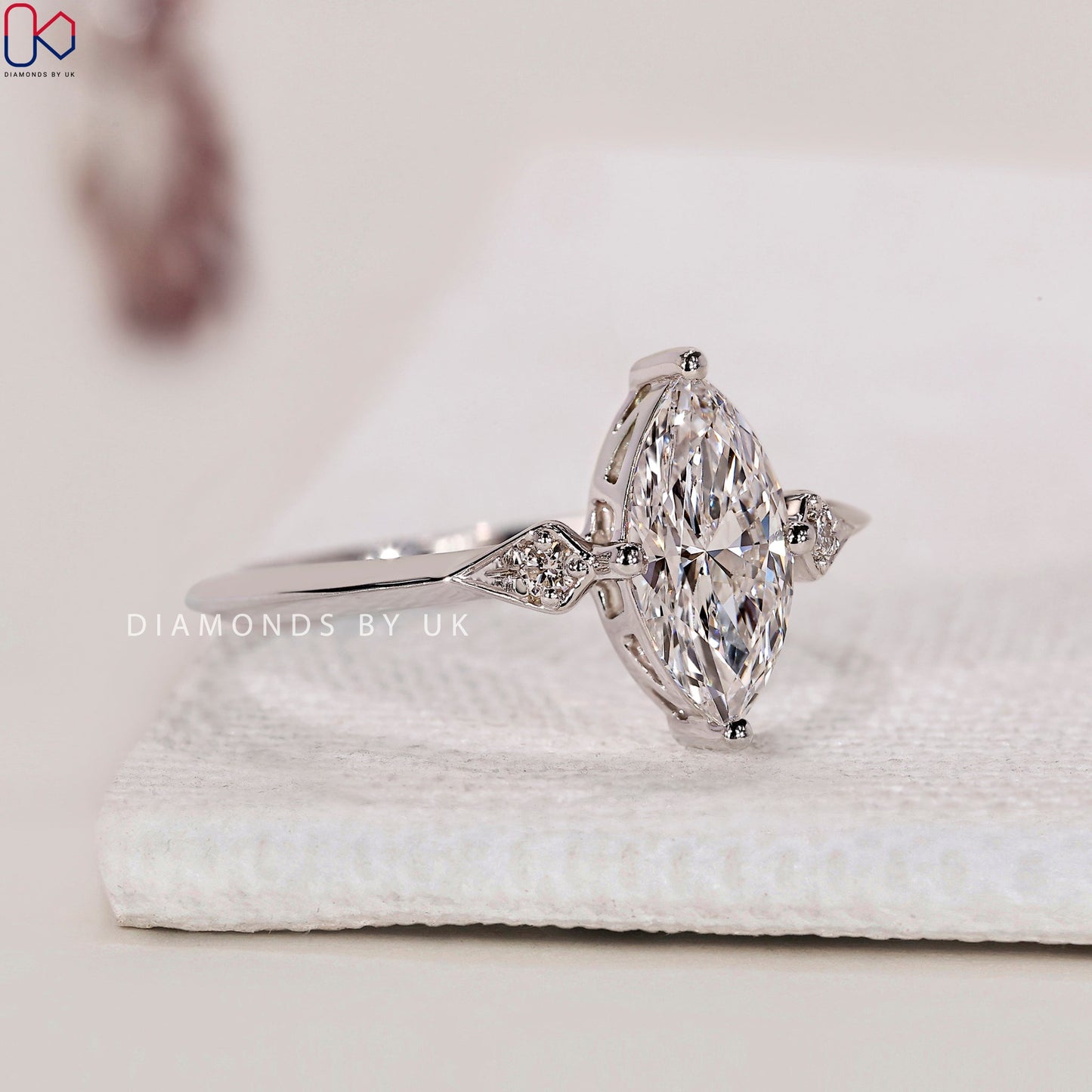 Marquise and Round Diamond engagement Ring In White Gold