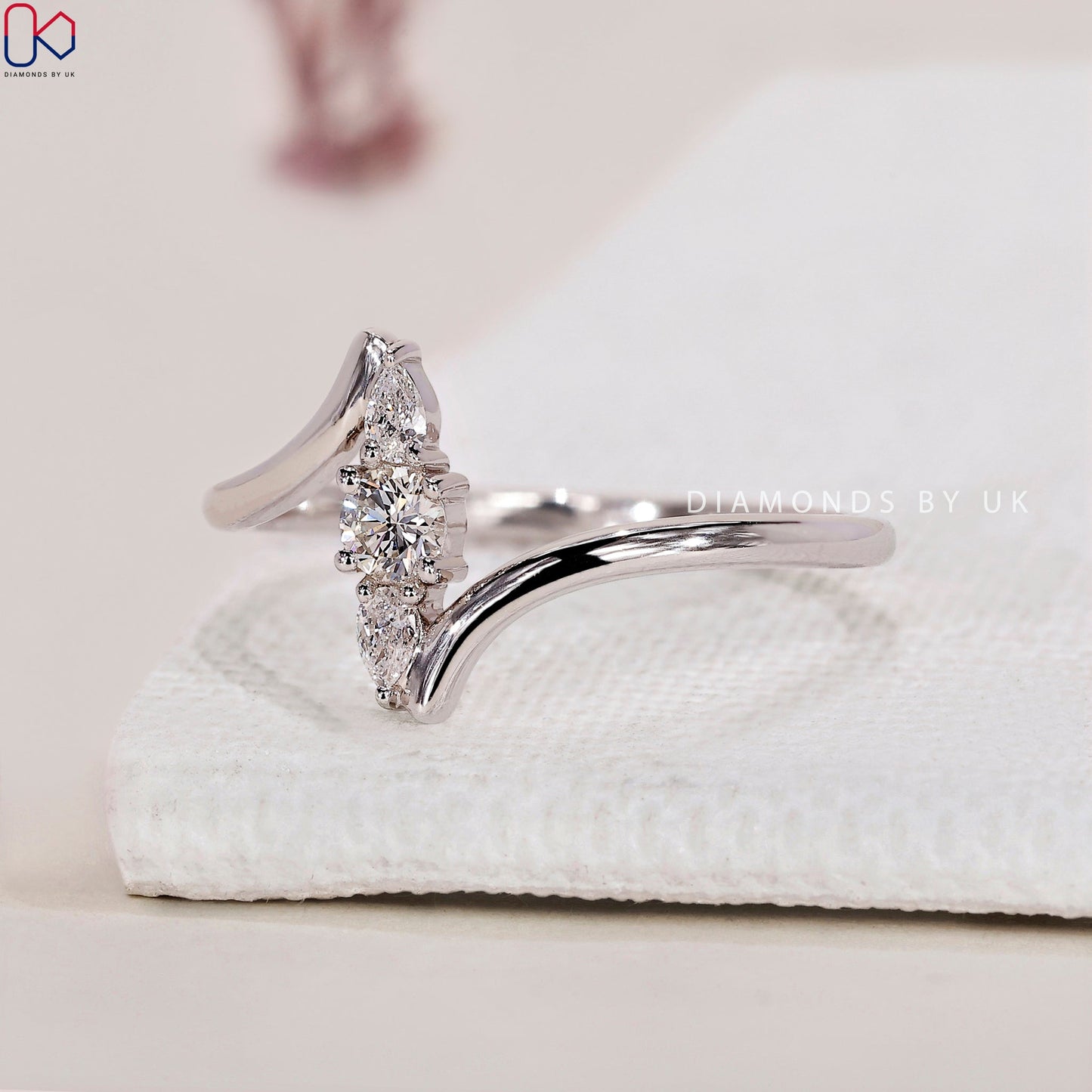 Round and Pear 3 Stone Diamond Ring
