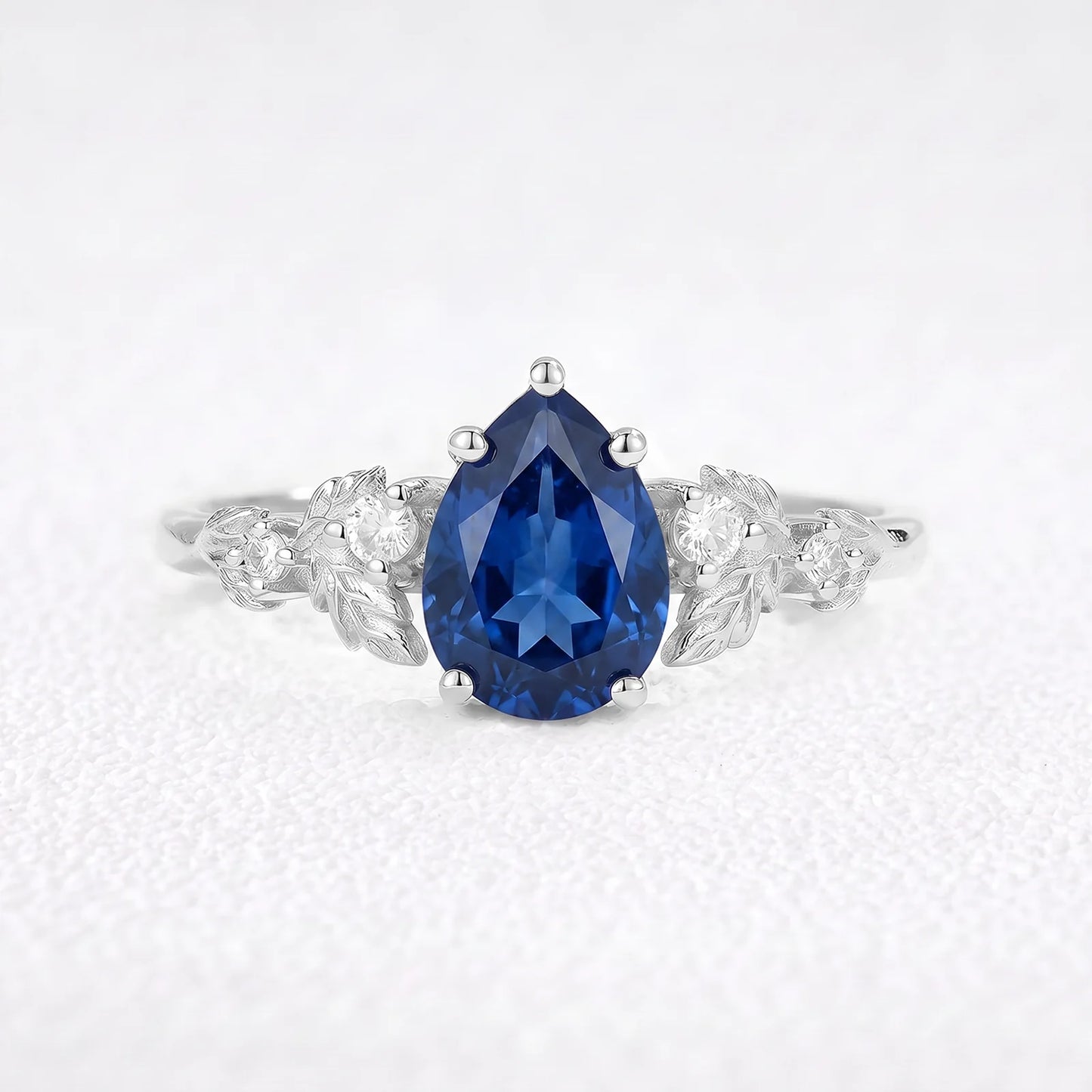 Daisy’s Twilight | 1.5CT Pear Cut Blue Sapphire Engagement Ring