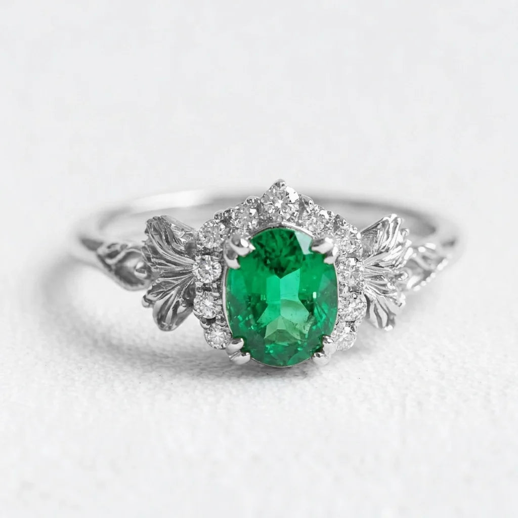 Isolde’s Heritage | Oval Natural Emerald & Diamond Halo Engagement Ring