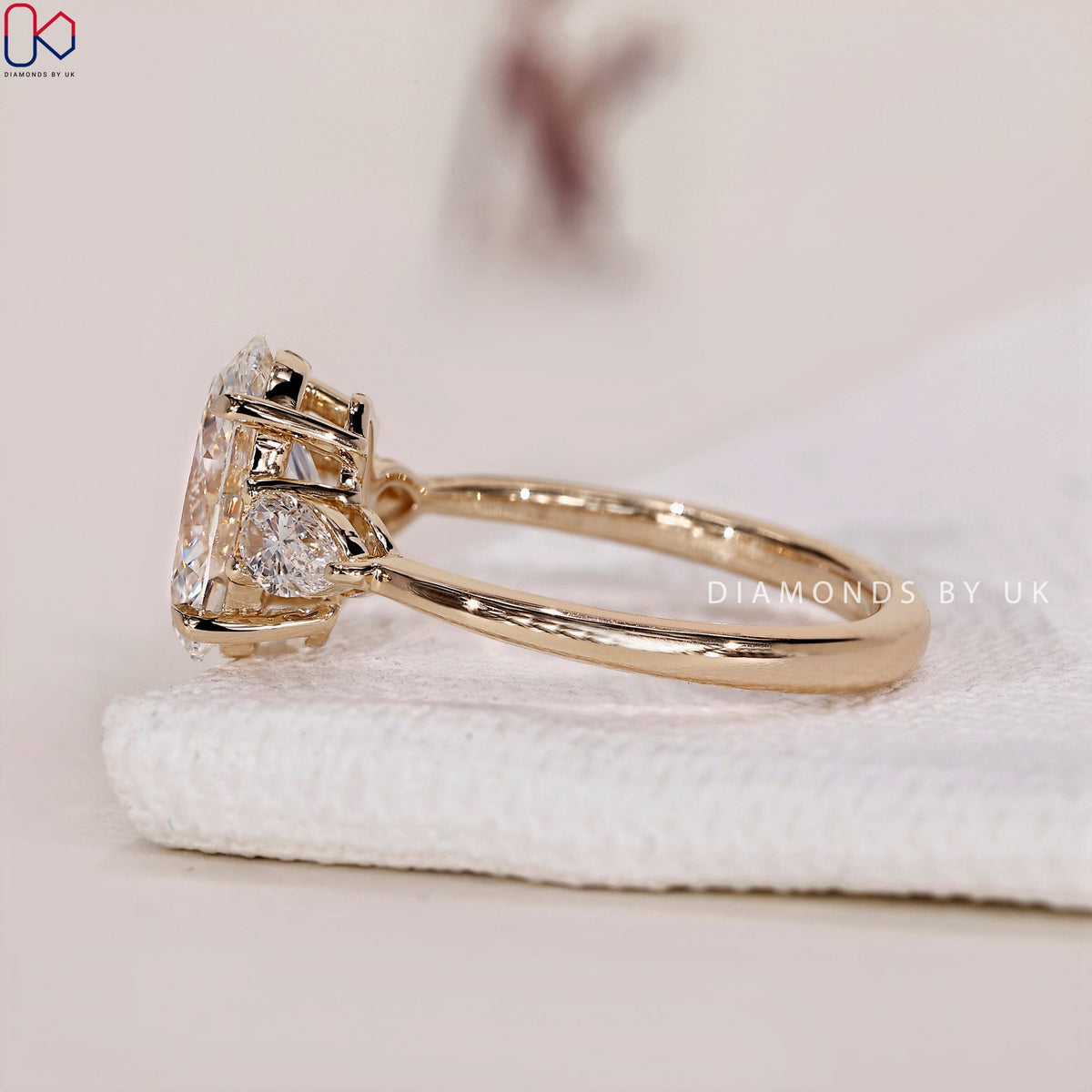 3 Stone Engagement Ring - Oval and Pear Diamond