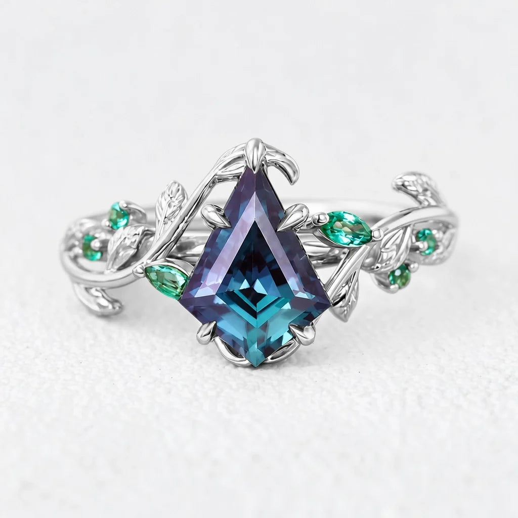 Celestine’s Mirage | Kite Alexandrite with Emerald Foliage Engagement Ring