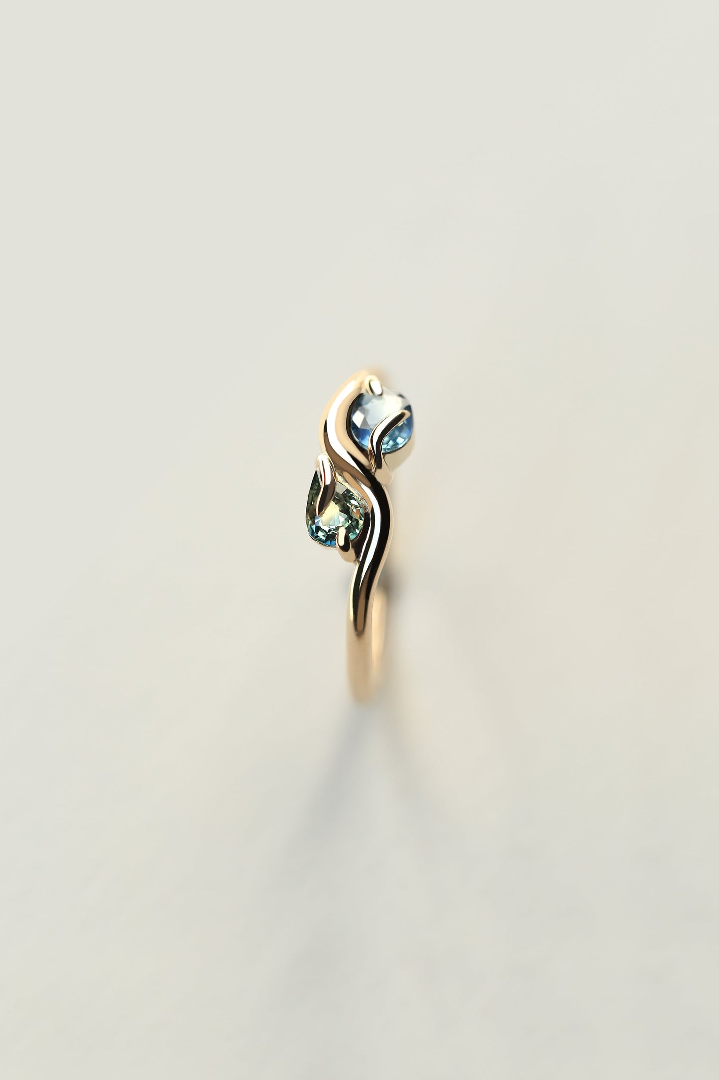 PAIRED OVAL AND PEAR CUT SAPPHIRE RING