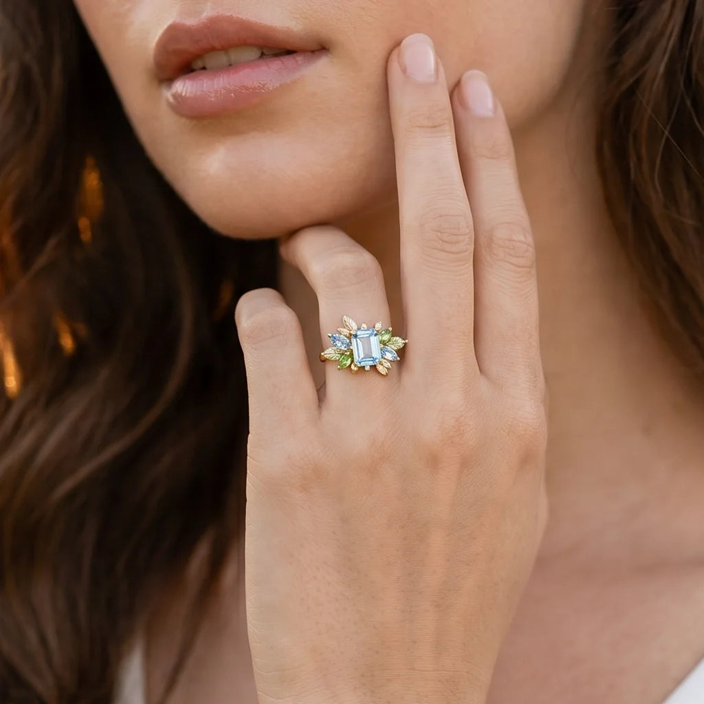 Celeste’s Bloom | Emerald Cut Blue Topaz Leafy Engagement Ring