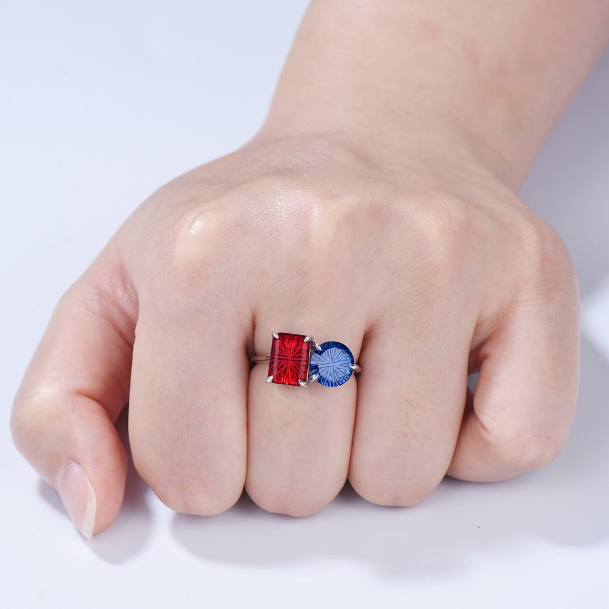 You and Me | Starburst Emerald Cut Blue Sapphire and Round Red Ruby Toi et Moi Engagement Ring