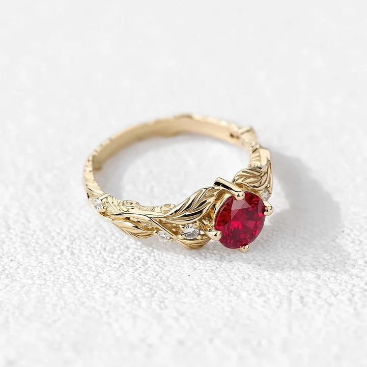 Rosalind’s Olive | Round Ruby Solitaire Ring with Olive Leaf Diamond Accents