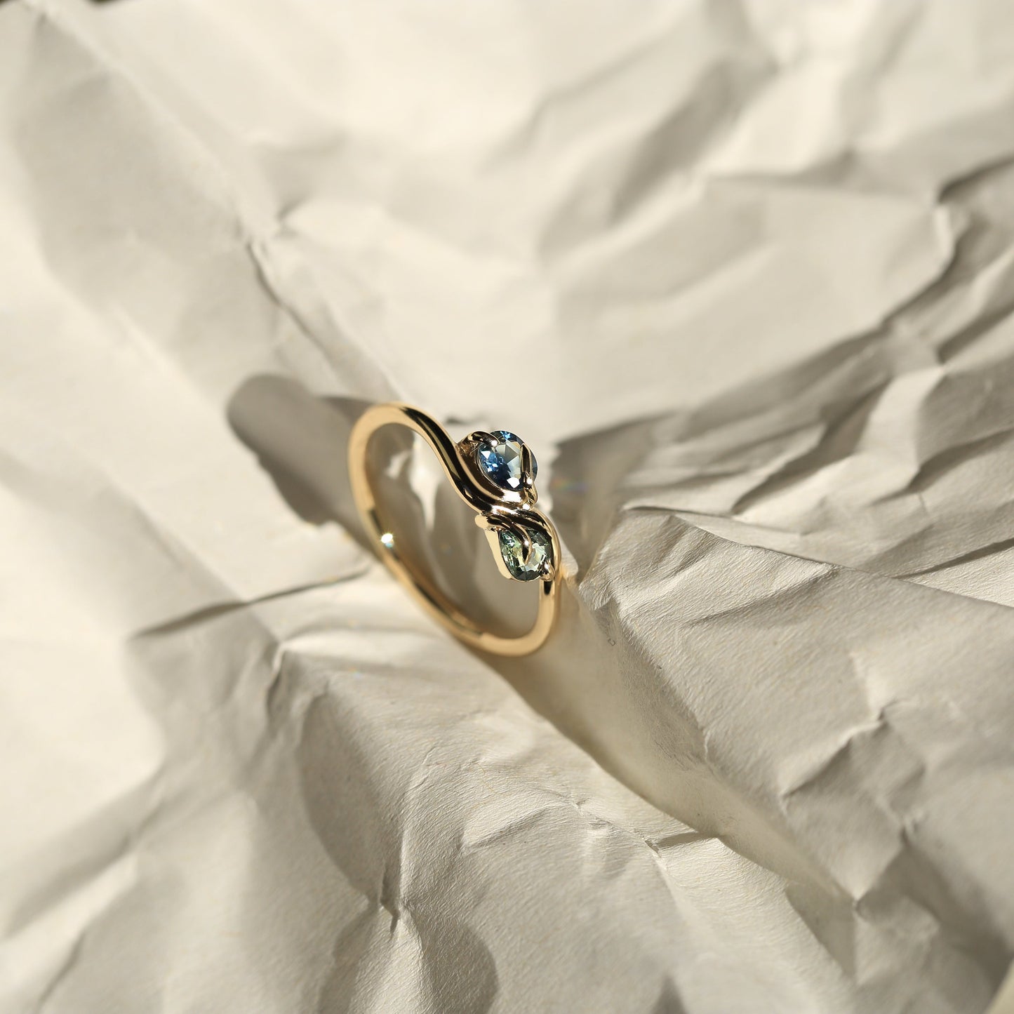 PAIRED OVAL AND PEAR CUT SAPPHIRE RING