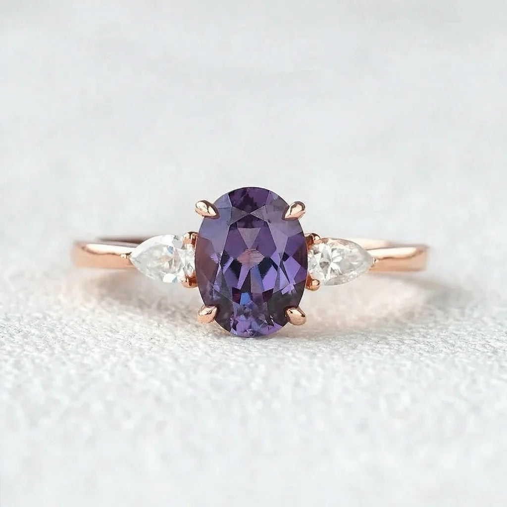 Aurora’s Ember | 1.5CT Oval Alexandrite & Diamond Three-Stone Engagement Ring