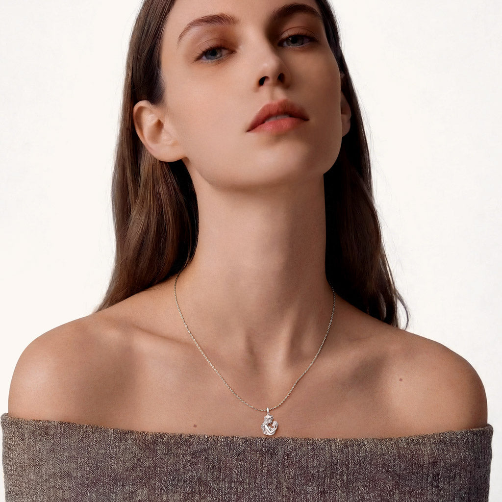 Gnoce  Mother Embraces Baby Pendant Necklace