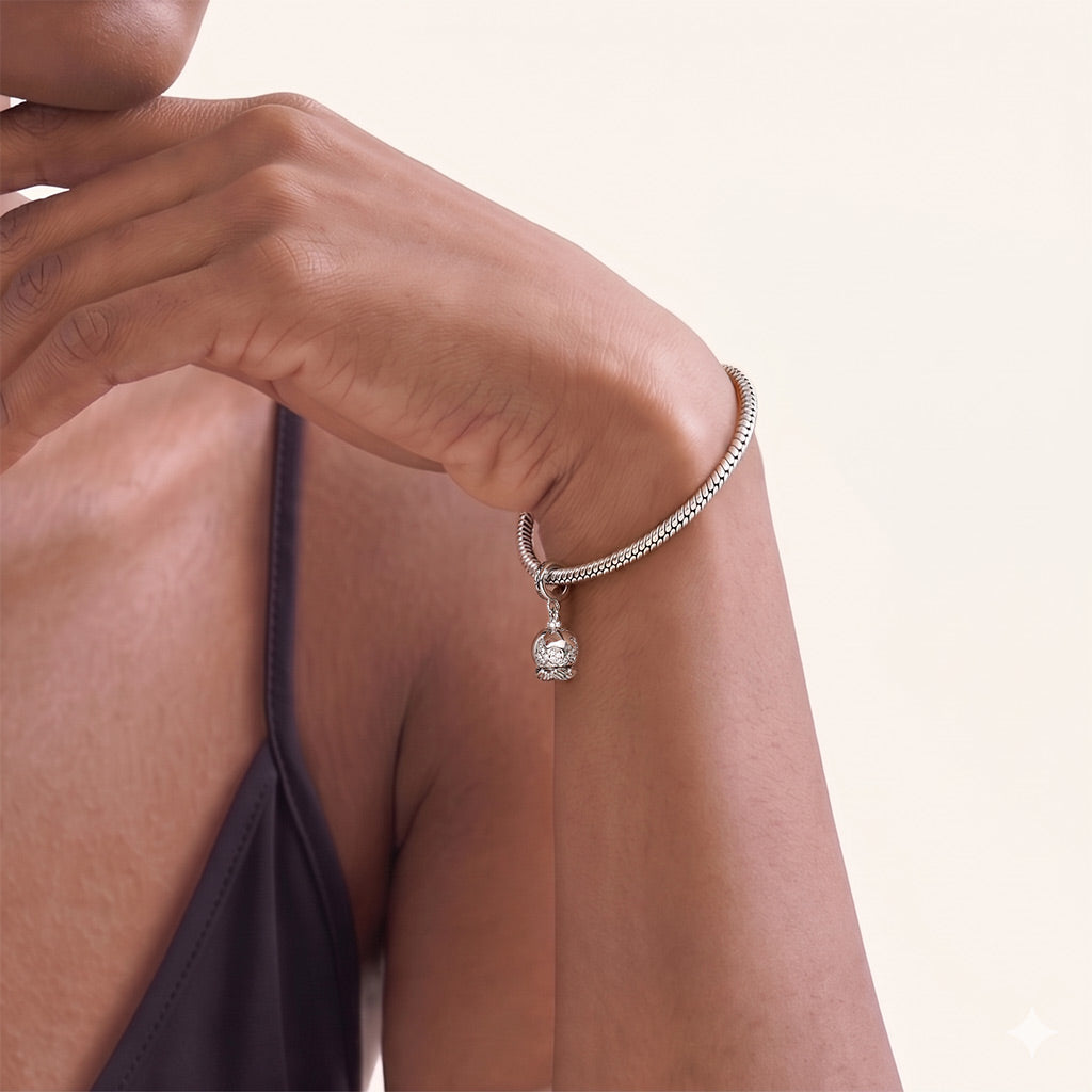 Gnoce  Holding A Rotating Earth Charm Platinum-plated Silver Blend