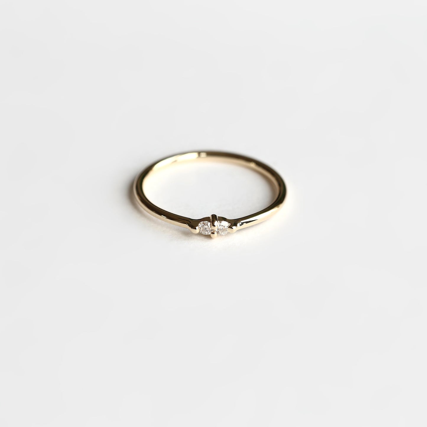 PAIRED WHITE DIAMOND RING