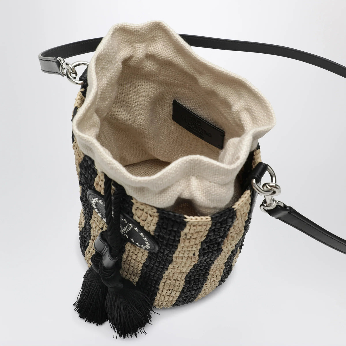 Valentino Garavani - Small bucket bag in raffia with beige and black stripes