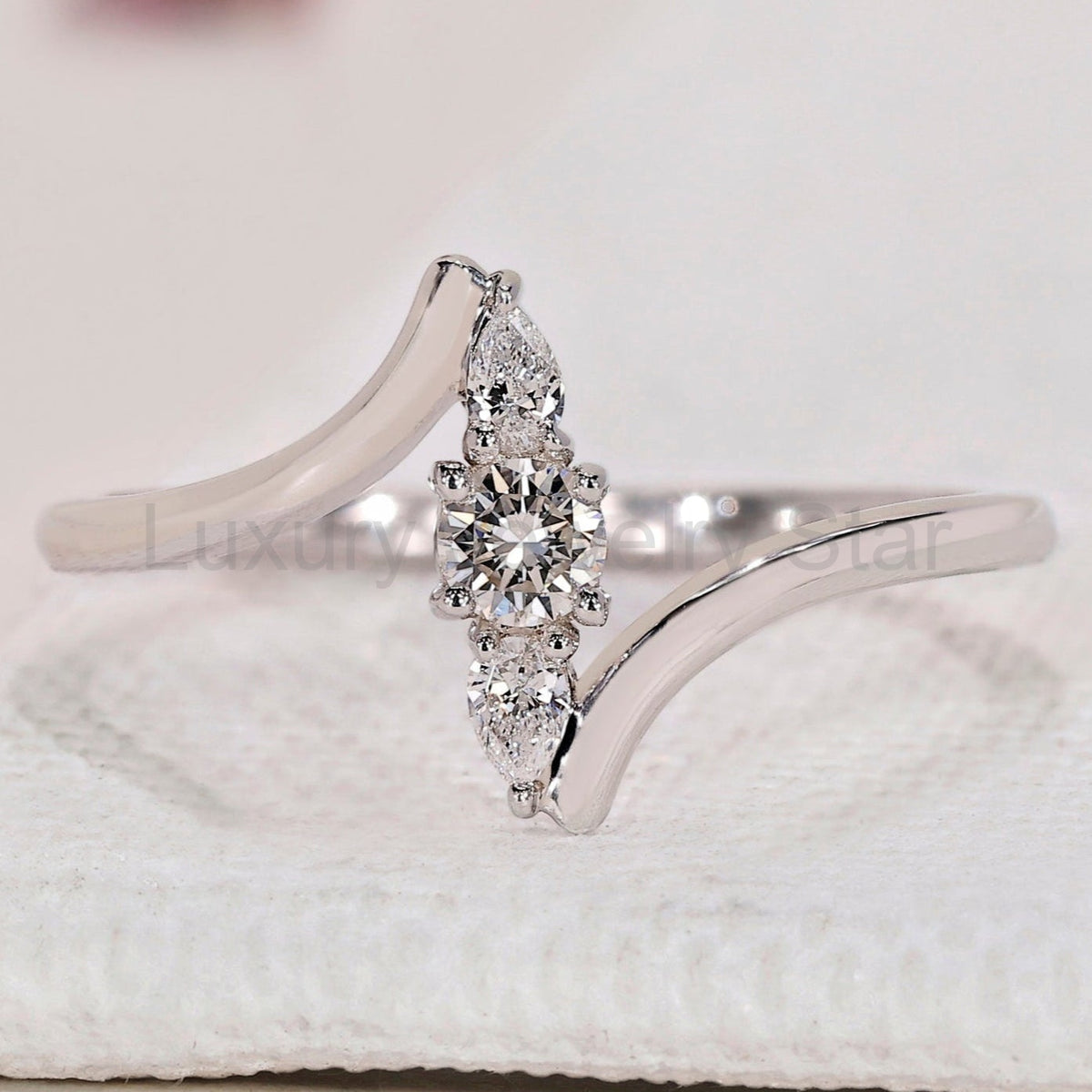 Round and Pear 3 Stone Diamond Ring