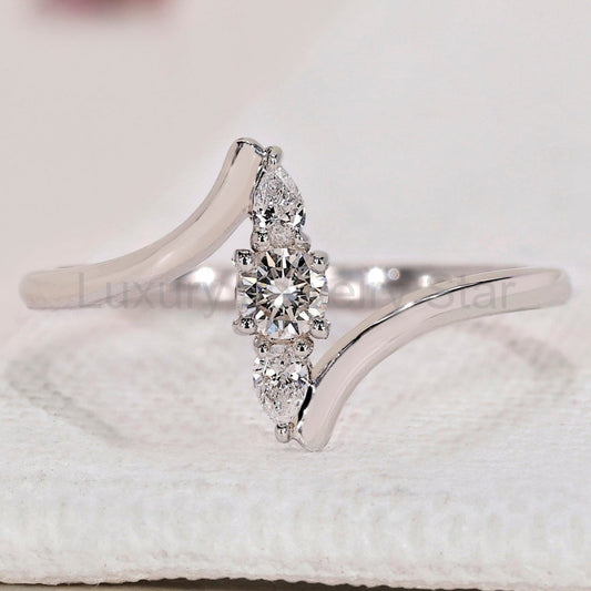 Round and Pear 3 Stone Diamond Ring