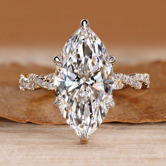 Marquise Engagement Ring with Twisted Shank and Round Accents