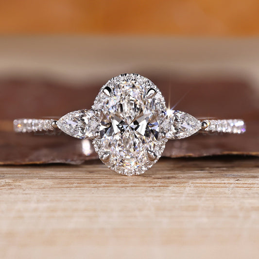 Oval Cut Engagement Ring with Pear Side Stone
