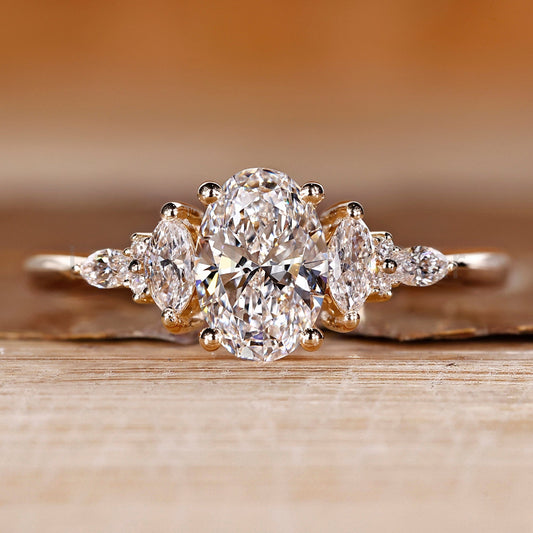 Oval Shaped Engagement Ring with Marquise and Round Side Stones
