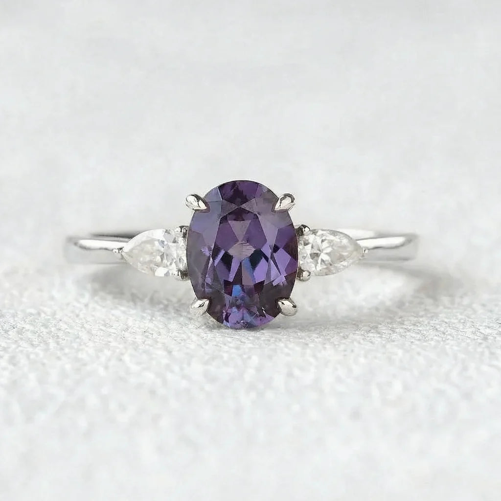Aurora’s Ember | 1.5CT Oval Alexandrite & Diamond Three-Stone Engagement Ring