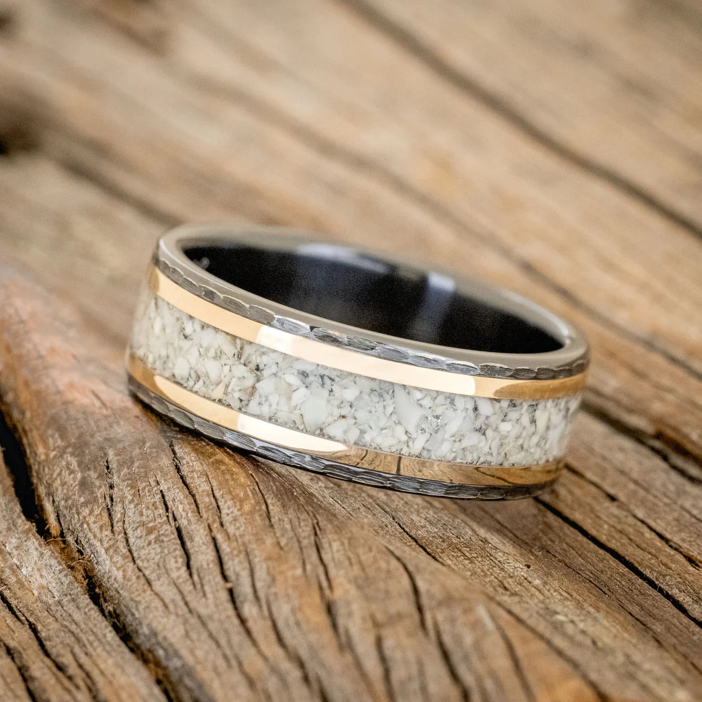 "Hollis" - Elk Tooth Ivory & 14K Yellow Gold Wedding Ring Featuring A Hammered Band - Black Zirconium (8mm) - Size 10 3/4