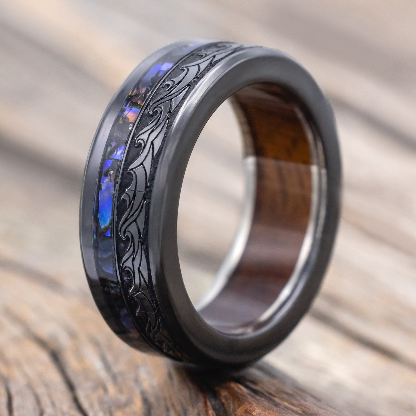 "Triton" - Wave Engraved Wedding Band With Paua Shell Inlay & Koa Wood Lining - Black Zirconium (8mm) - Size 10 1/2
