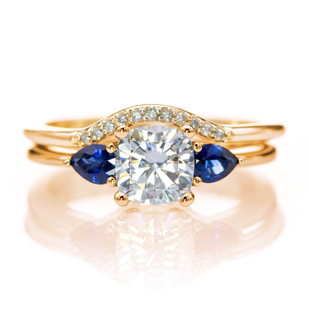 Tressa Bridal Set- Three Stone Cushion Moissanite & Pear Blue Sapphire Engagement Ring & Cecilia Band