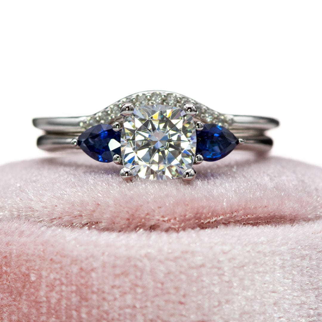 Tressa Bridal Set- Three Stone Cushion Moissanite & Pear Blue Sapphire Engagement Ring & Cecilia Band