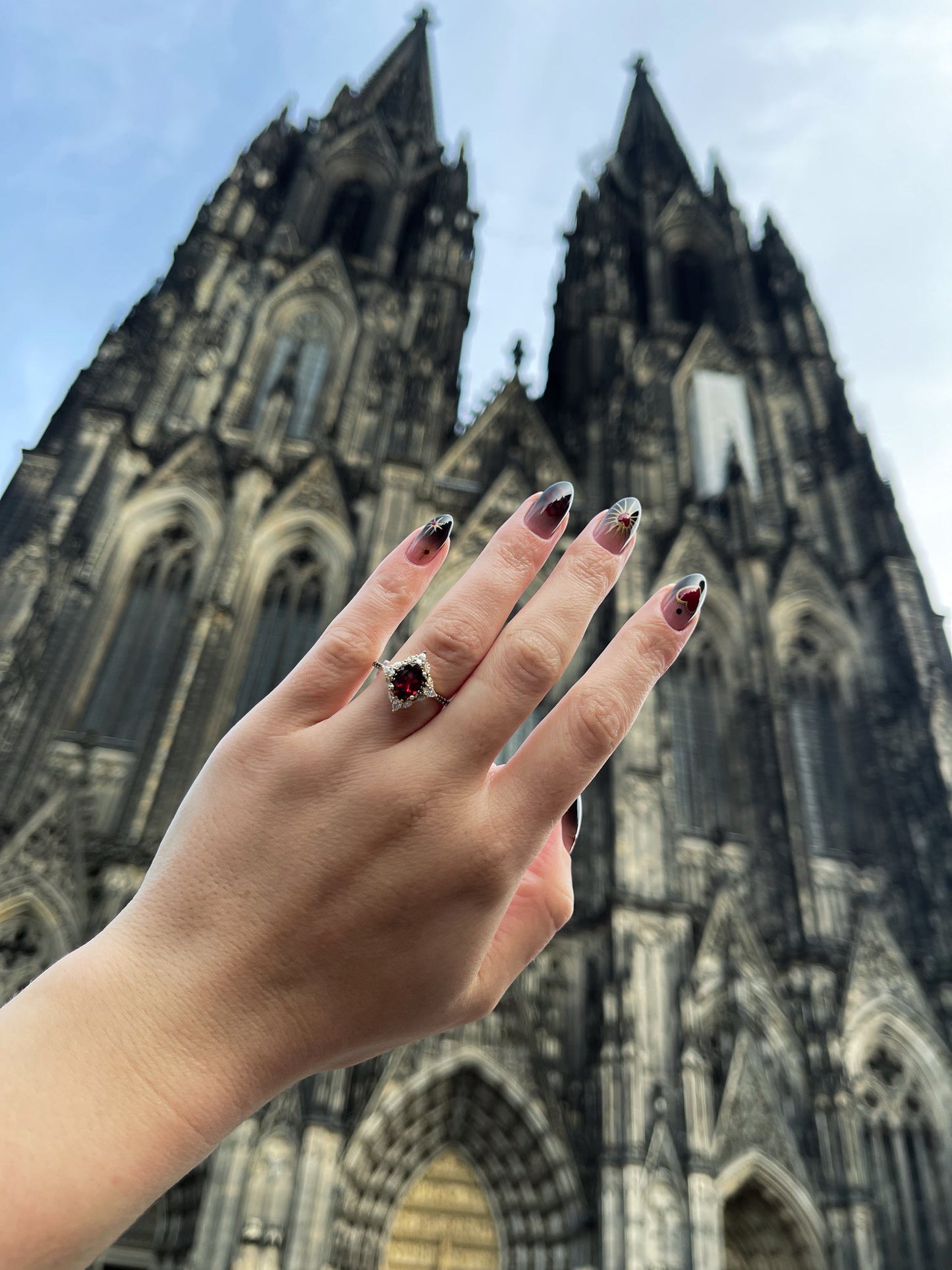"North Star" - Oval Garnet Engagement Ring With Diamond Halo & Accents