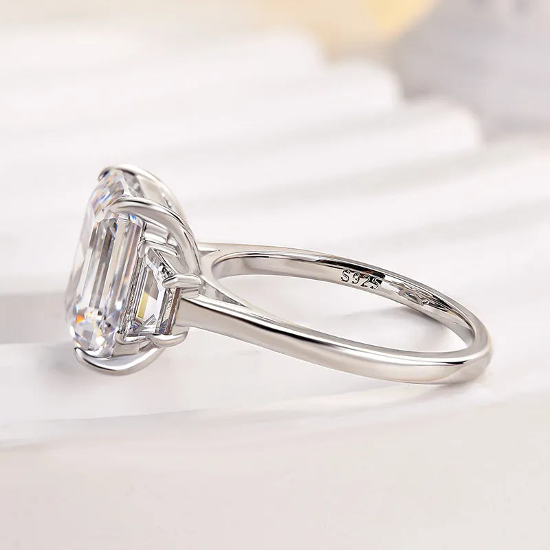 Lavish Emerald Cut 4.0ct Three Stone Engagement Ring In Sterling Silver