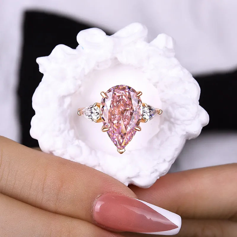 Majestic Pear Cut 4.0ct Pink Stone Three Stone Engagement Ring In Sterling Silver