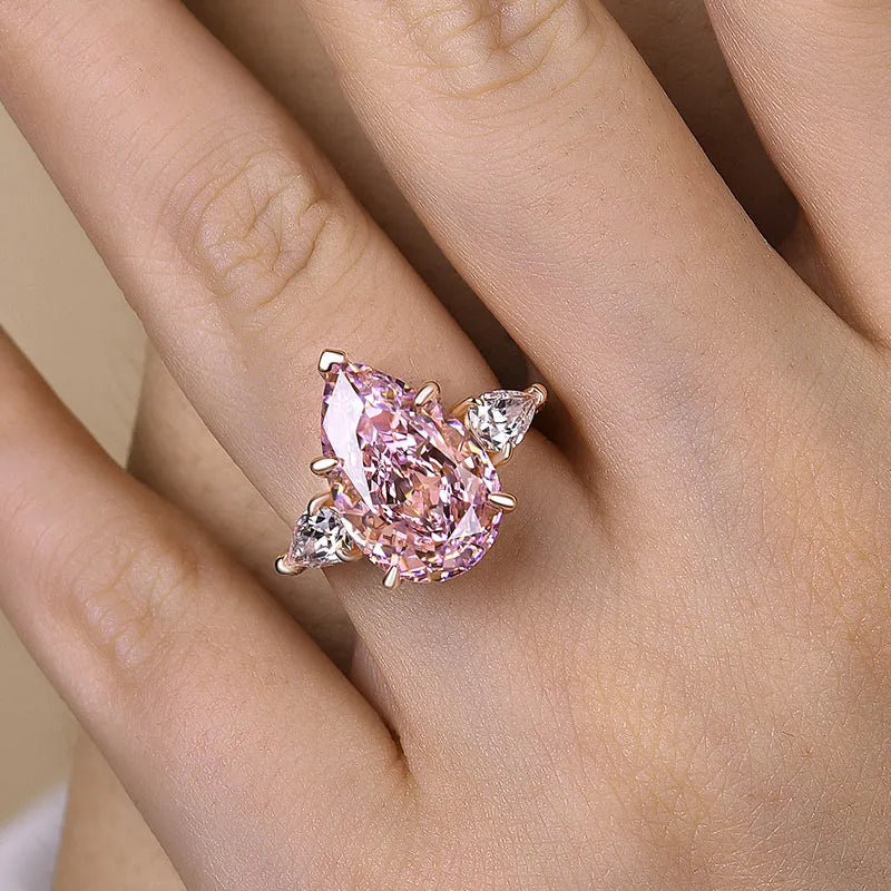 Majestic Pear Cut 4.0ct Pink Stone Three Stone Engagement Ring In Sterling Silver