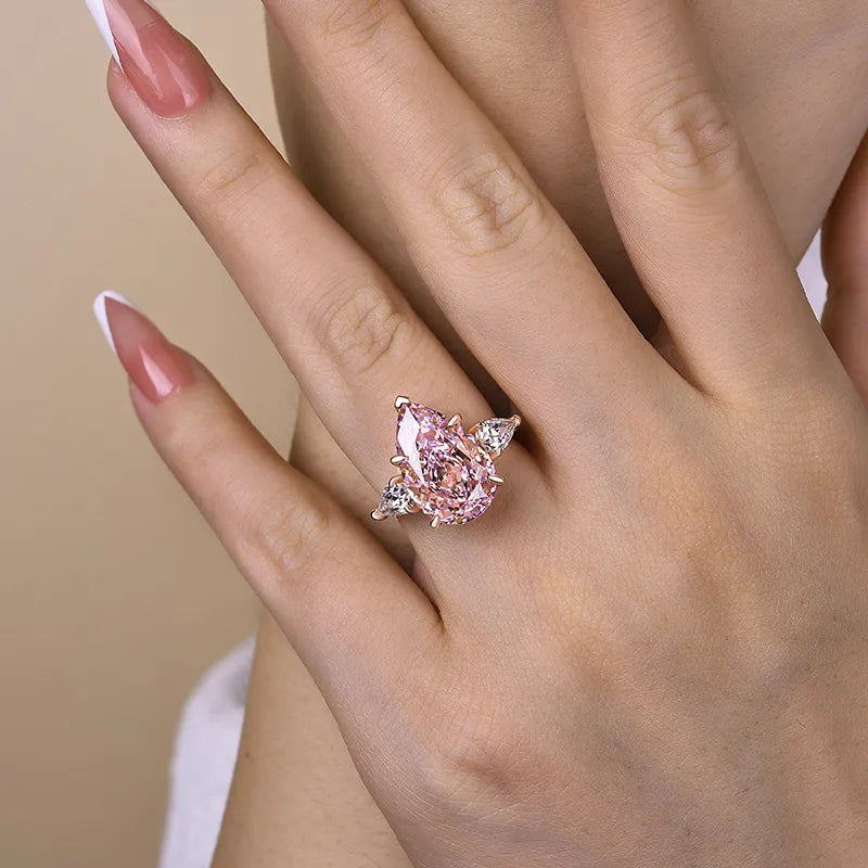Majestic Pear Cut 4.0ct Pink Stone Three Stone Engagement Ring In Sterling Silver