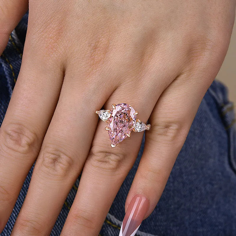 Majestic Pear Cut 4.0ct Pink Stone Three Stone Engagement Ring In Sterling Silver