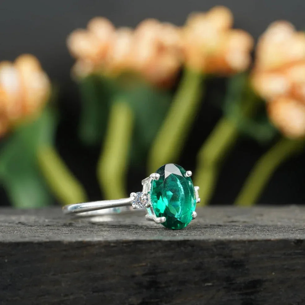 Oval Cut Emerald & Zirconia Three Stone Engagement Ring