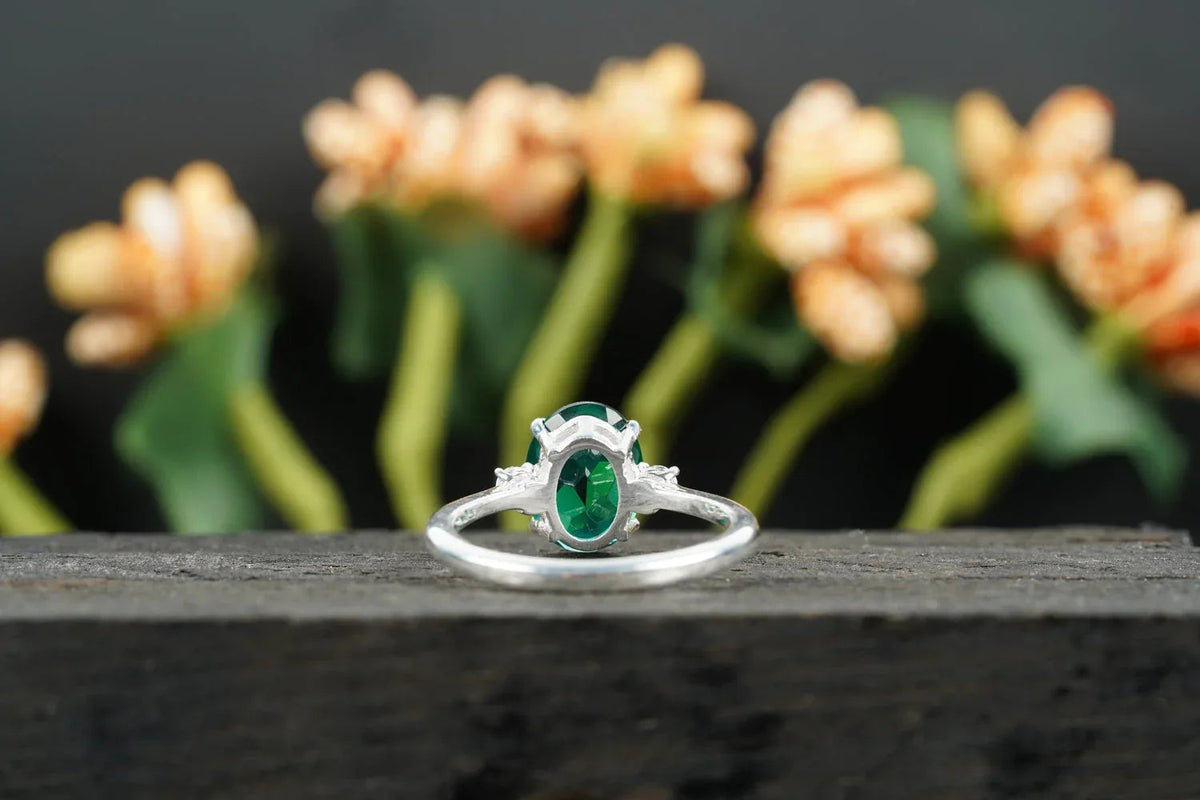 Oval Cut Emerald & Zirconia Three Stone Engagement Ring