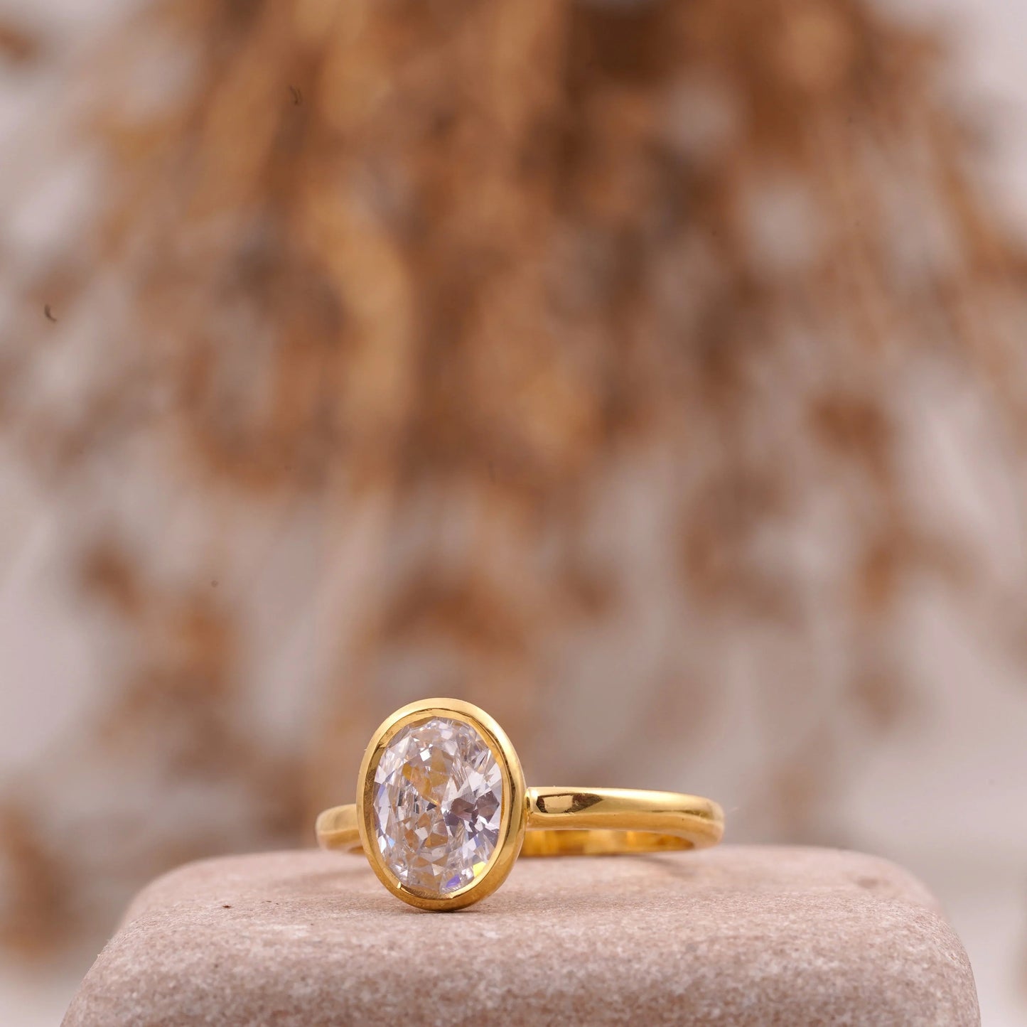 Oval Cut Bezel Set Engagement Ring