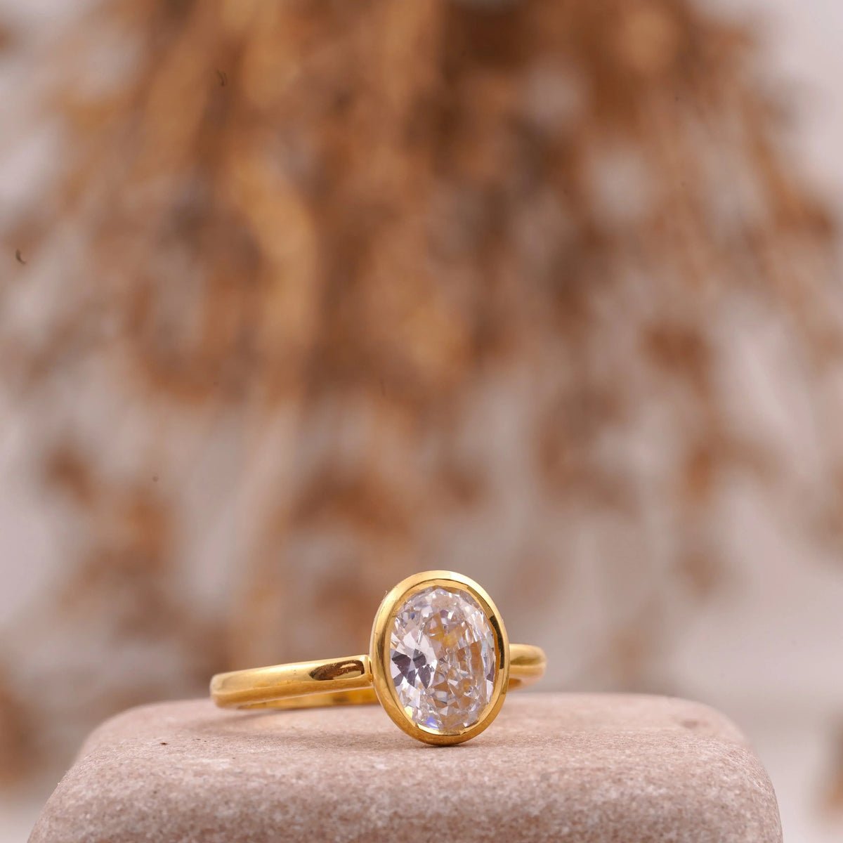 Oval Cut Bezel Set Engagement Ring