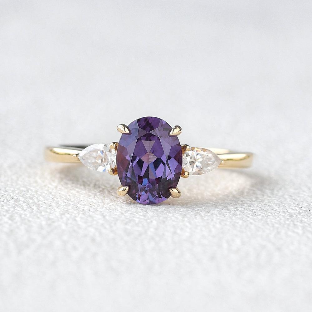 Aurora’s Ember | 1.5CT Oval Alexandrite & Diamond Three-Stone Engagement Ring