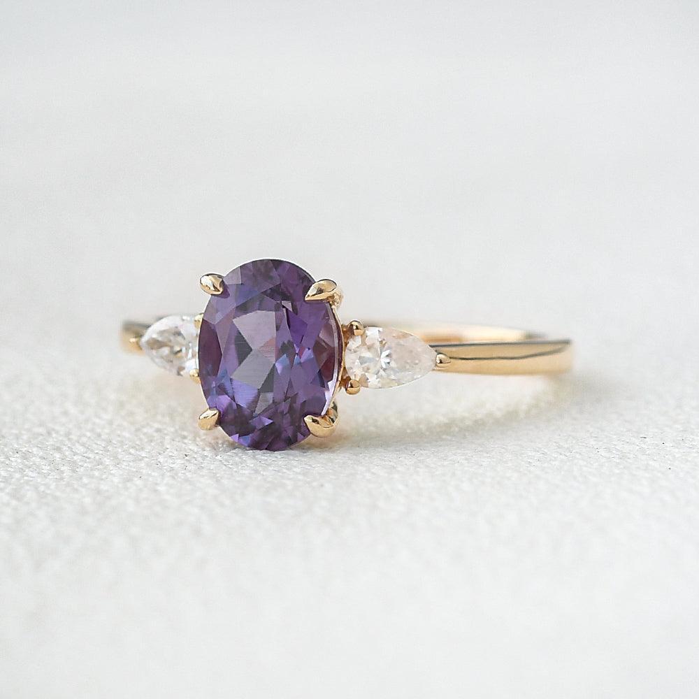 Aurora’s Ember | 1.5CT Oval Alexandrite & Diamond Three-Stone Engagement Ring