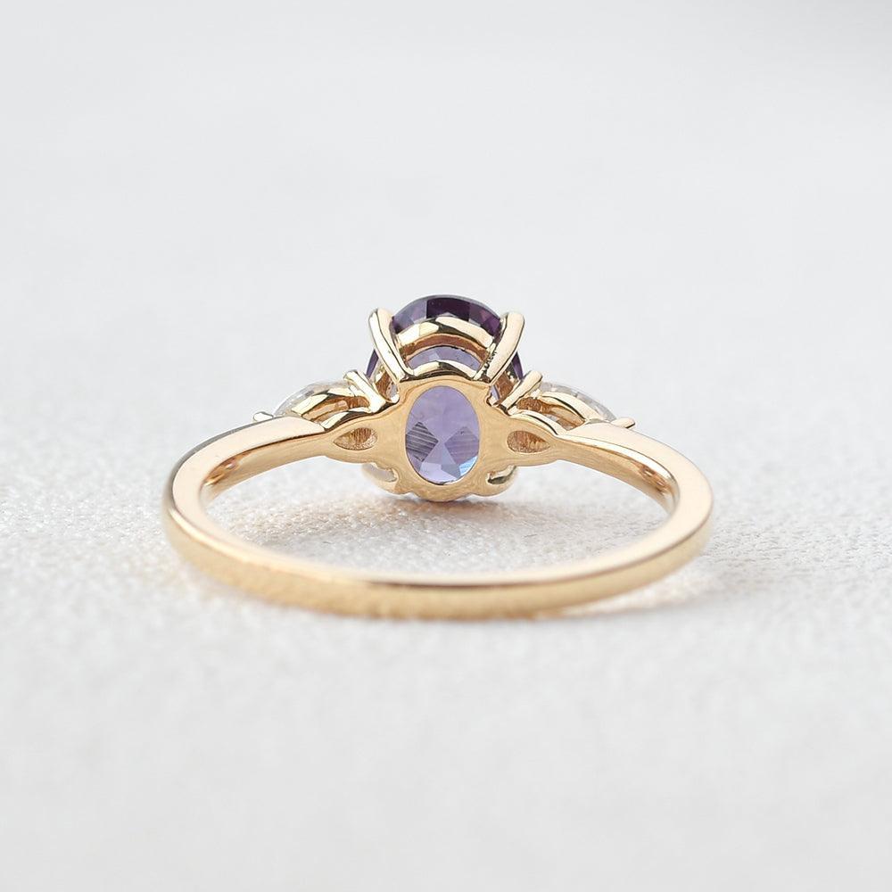 Aurora’s Ember | 1.5CT Oval Alexandrite & Diamond Three-Stone Engagement Ring