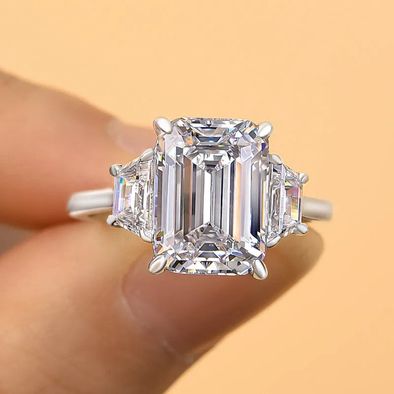 Lavish Emerald Cut 4.0ct Three Stone Engagement Ring In Sterling Silver