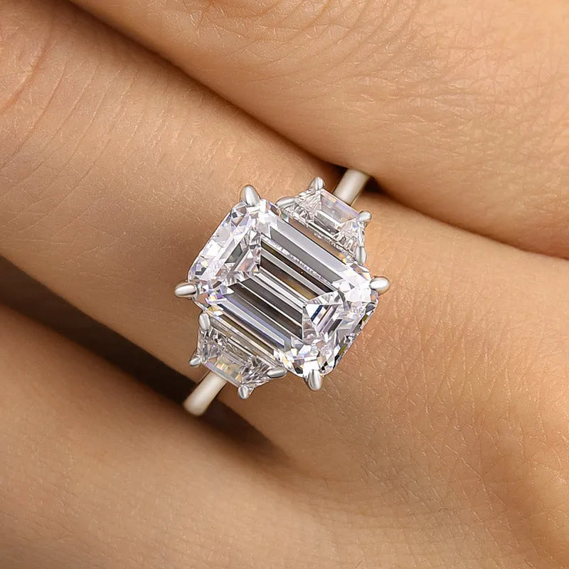 Lavish Emerald Cut 4.0ct Three Stone Engagement Ring In Sterling Silver
