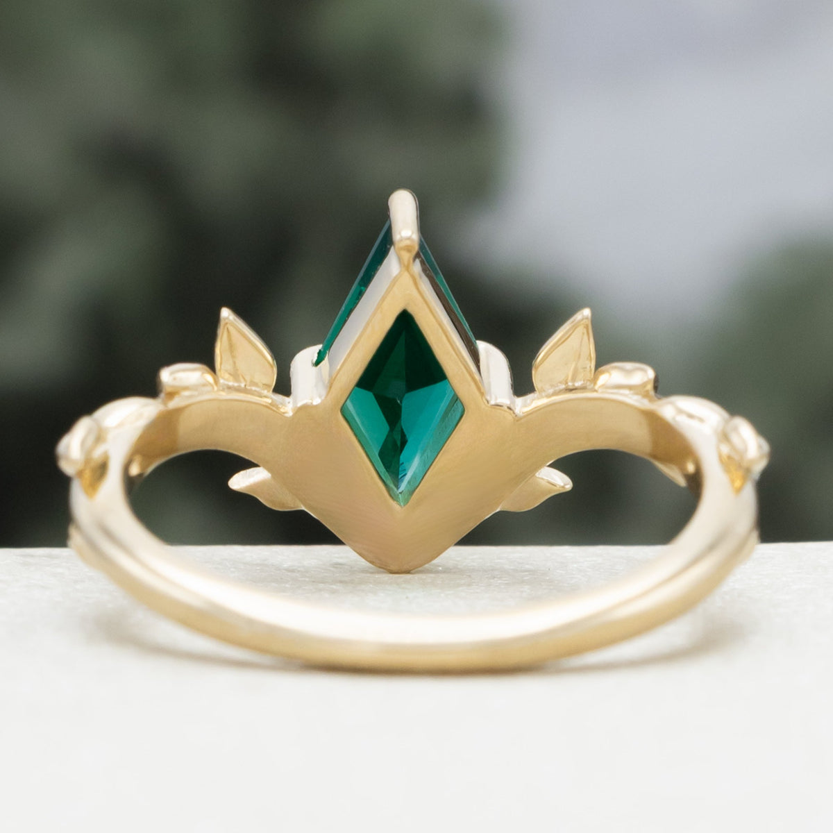 "Fae" - Solitaire Lozenge Cut Lab-Grown Emerald Engagement Ring On A Branch-Style Band