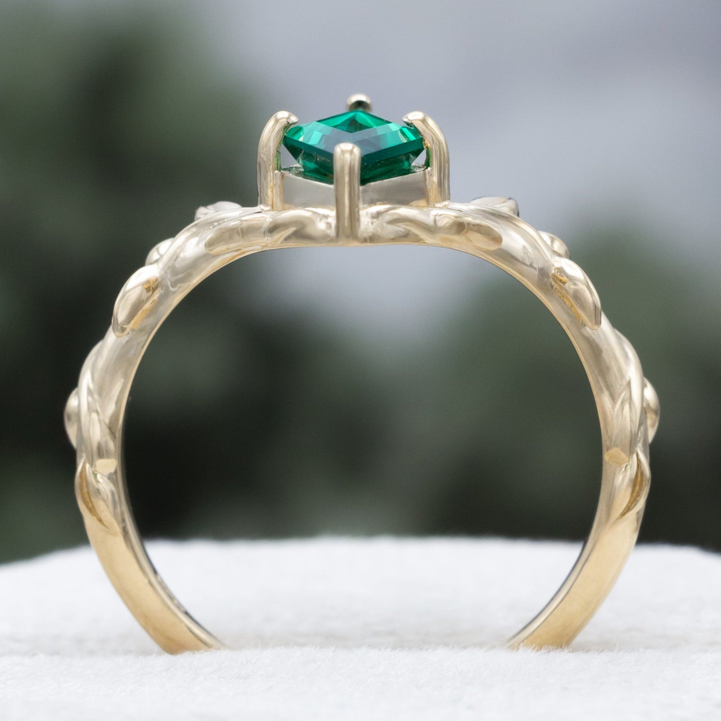 "Fae" - Solitaire Lozenge Cut Lab-Grown Emerald Engagement Ring On A Branch-Style Band