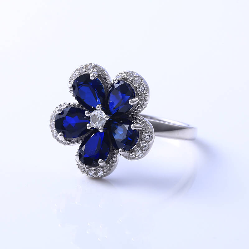 Five Petal Halo Pear Sapphire Flower Ring In Sterling Silver