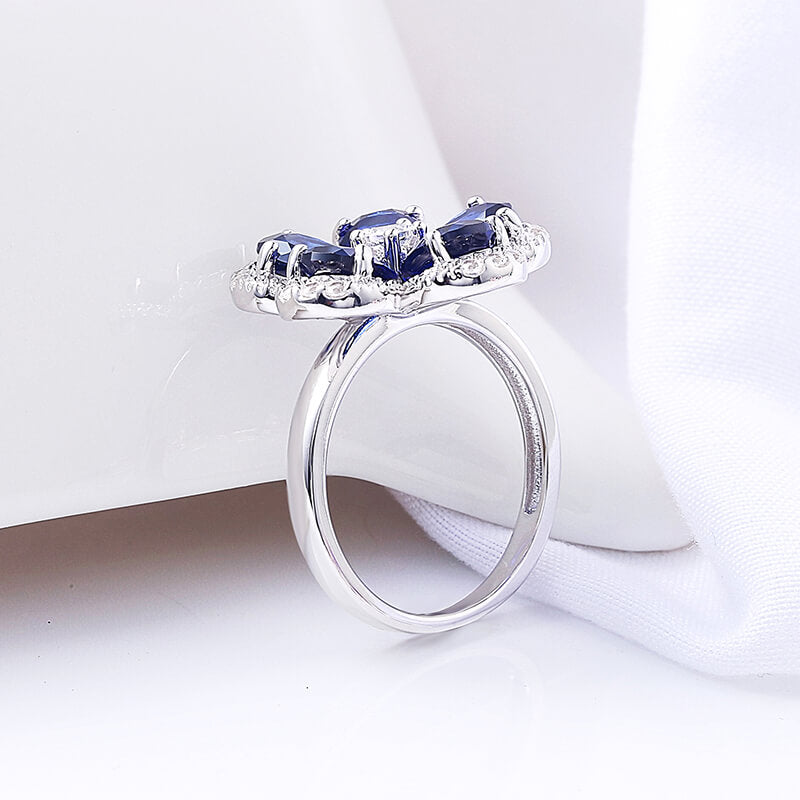 Five Petal Halo Pear Sapphire Flower Ring In Sterling Silver