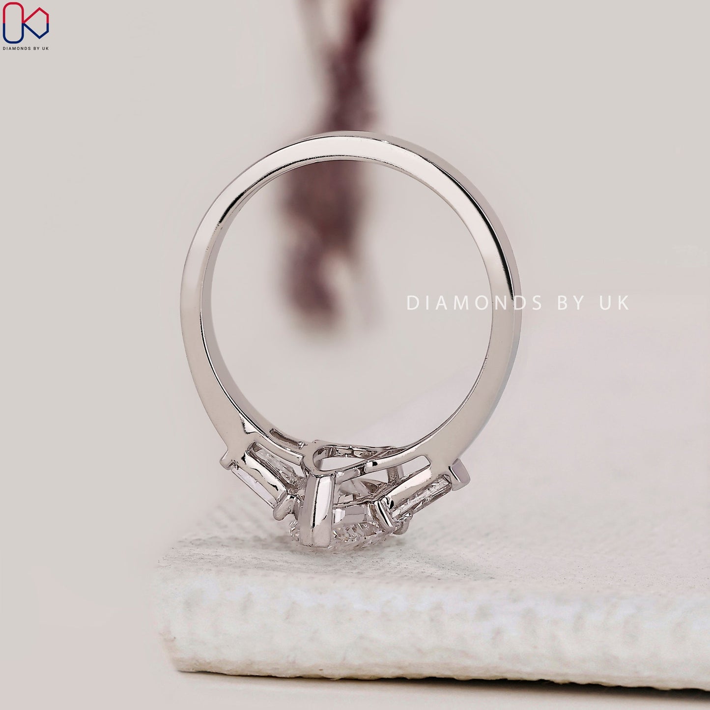 Teardrop Diamond Ring With 2 Tapered Baguette Side Stone