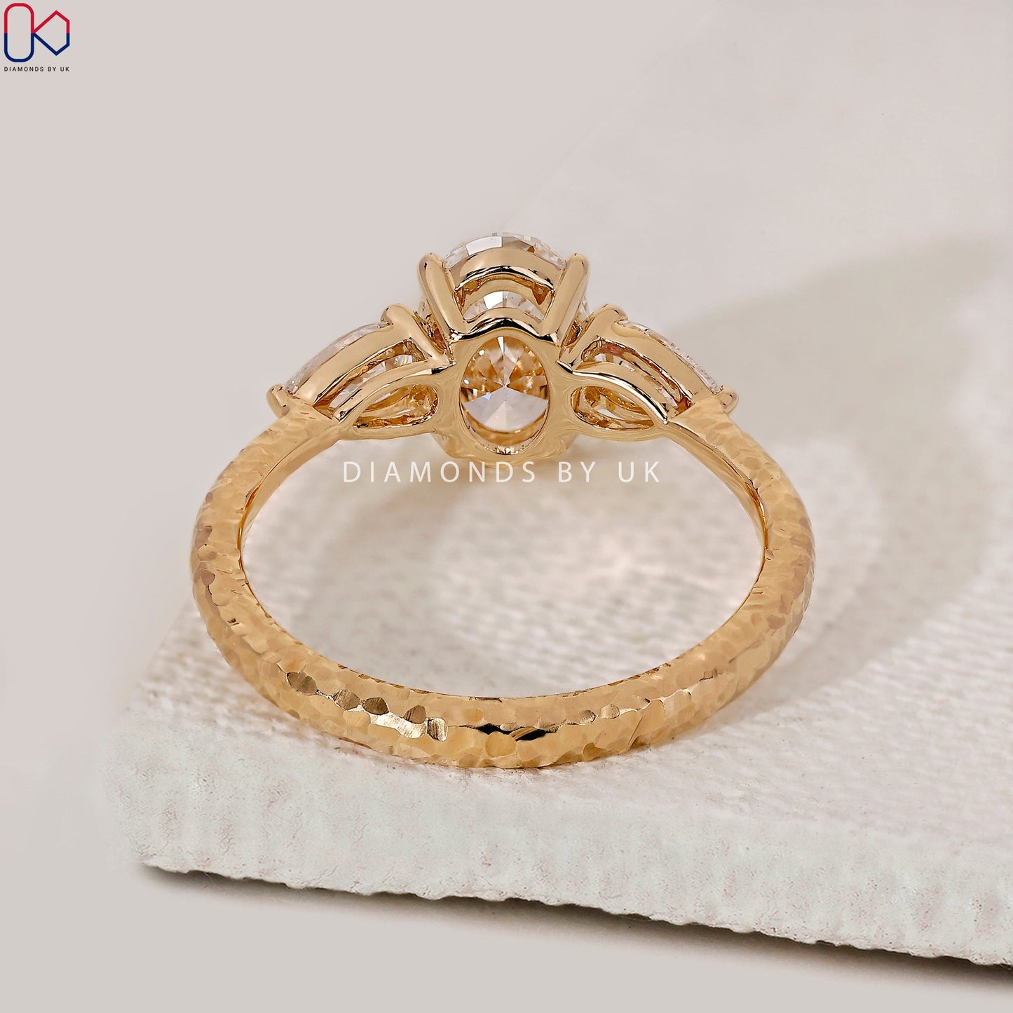 3 Stone Diamond Engagement Ring In Oval And Pear Cut Stone