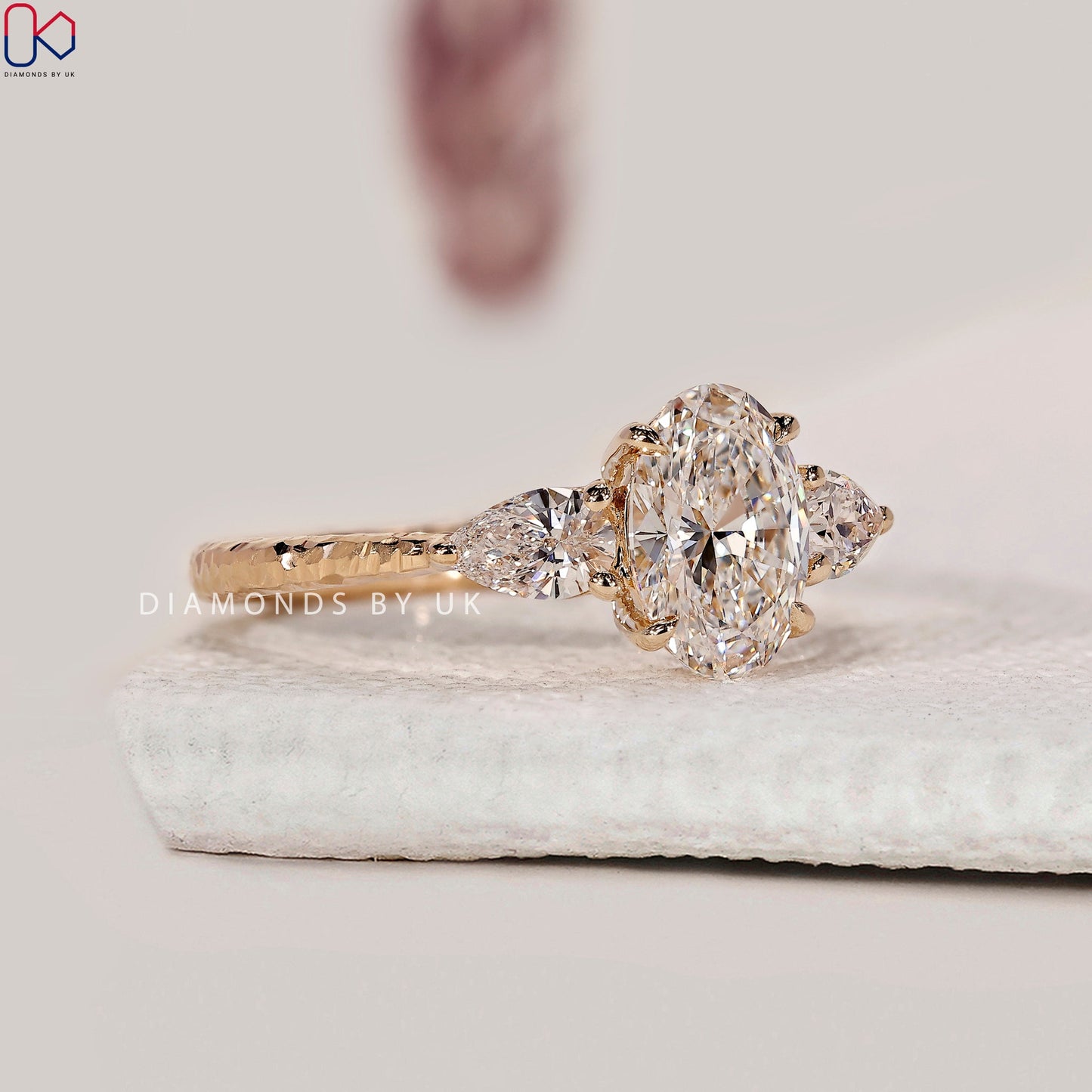 3 Stone Diamond Engagement Ring In Oval And Pear Cut Stone